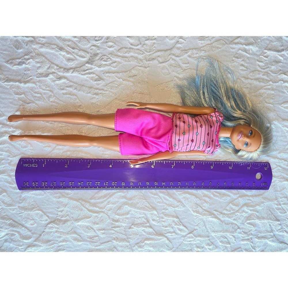 Mattel Barbie Makeup Artist figure, distinguished by her vibrant blue hair